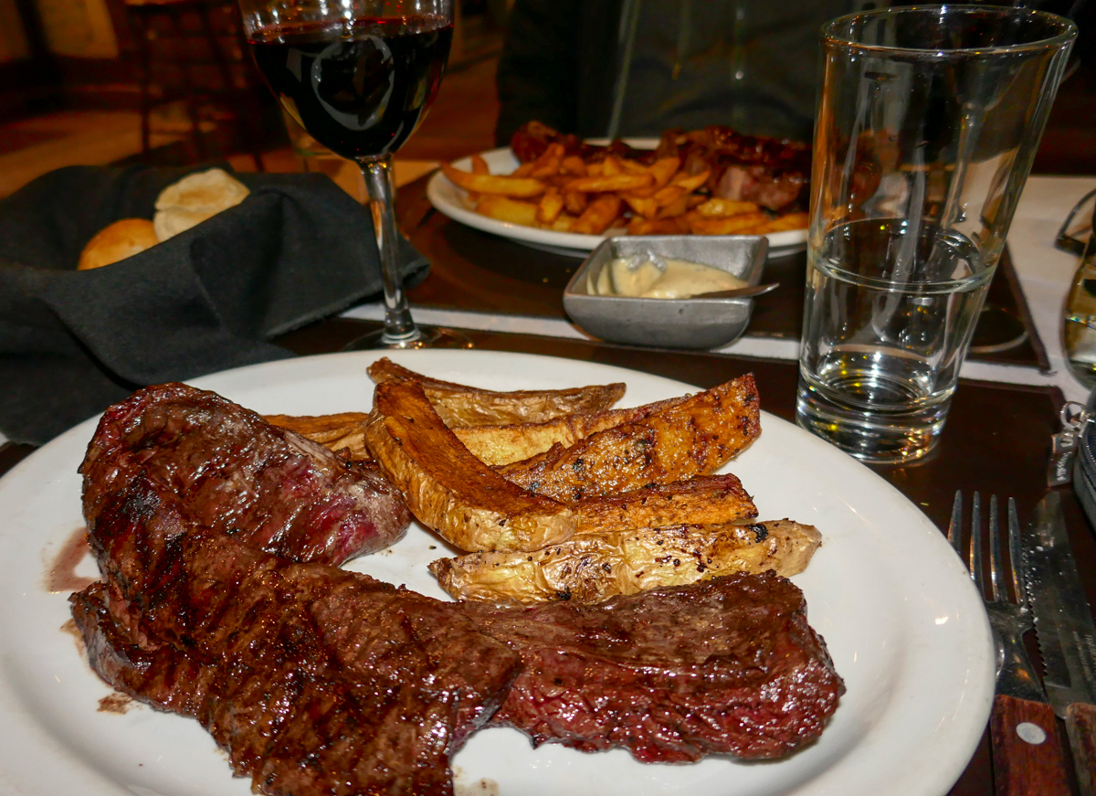 Two steak meals and a bottle of Malbec wine = $68 CAD/$50 USD